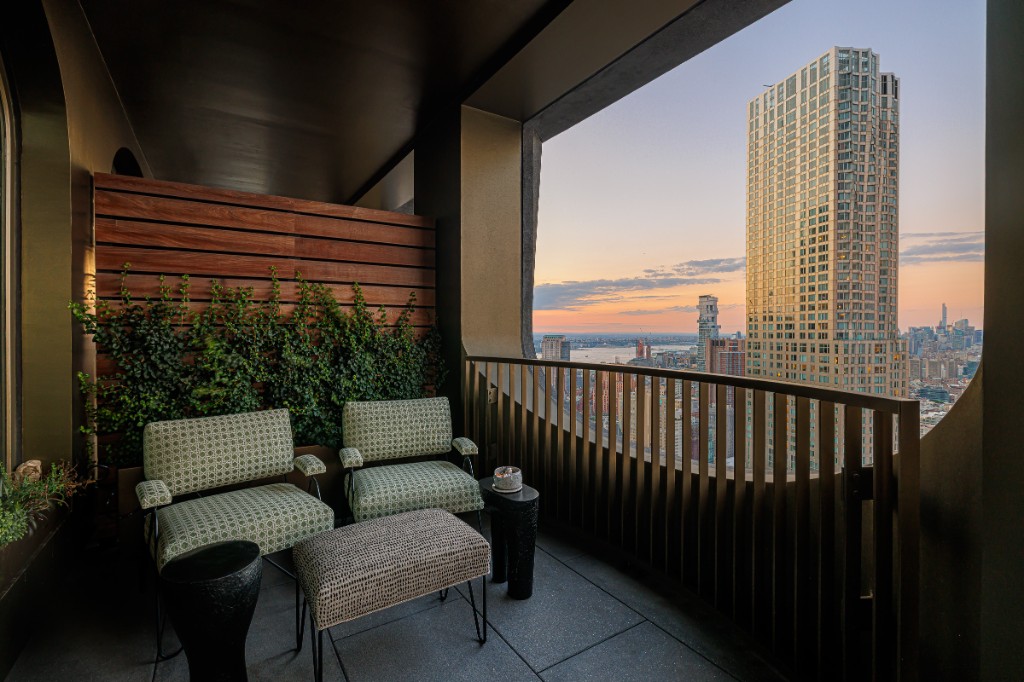 Loggia at sunset with city skyline